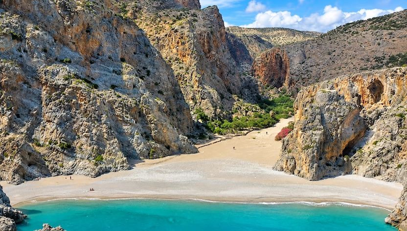 Agiofaraggo Gorge leading to a secluded turquoise pebble beach